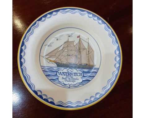 A Poole pottery 'Waterwitch' plate decorated with a sailing ship, made and painted in the year 1955, ship drawn by Arthur Bra