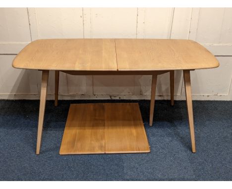 A Ercol light elm extending dining table with extra hinged double leaf on sloping legs (a/f) 154cm extending to 223cm