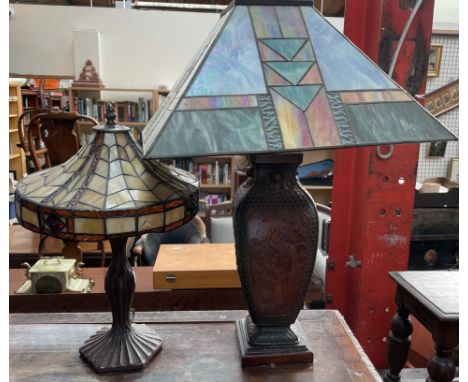 An Oriental inspired lamp base with a Tiffany style lamp shade together with another table lamp with Tiffany style lamp shade