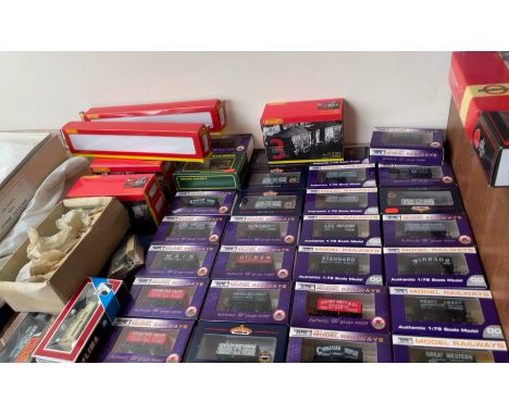A collection of Hornby and Dapol model train carriages etc