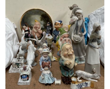 Lladro figures, together with Nao figures, dogs of foo, fairings, plaster dwarves etc