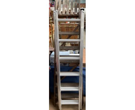 A wooden step ladder together with an aluminium ladder