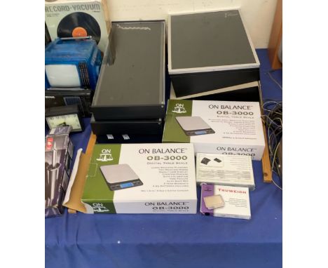 Five table top ring display cabinets together with electronic balance scales