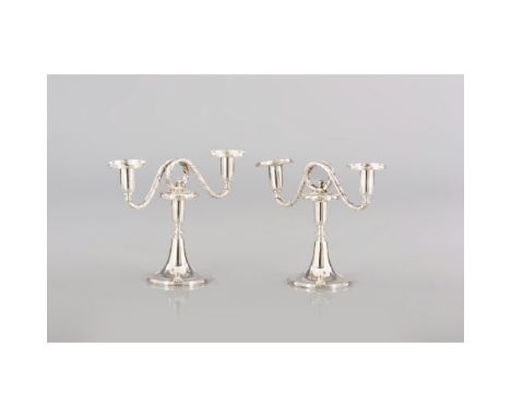 A Pair of two-light serpentine candelabra833/000 silverRims with relief stripes and ribbons Oporto assay mark (1887-1937) and