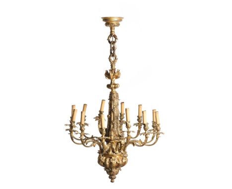 A George III style twelve light chandelierGilt bronzeRich relief and chiseled decoration depicting foliage motifsEngland, c. 