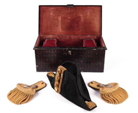 A British Naval officer's dress bicorn, epaulettes and sword belt, in fitted toleware box with brass label for Gieve, Matthew