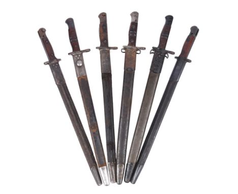 Two British 1907 pattern bayonets, one by Sanderson and one by Wilkinson, steel mounted leather scabbards; together with four