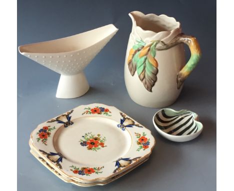 A Clarice Cliff Newport pottery jug with leaf and cloud design H19cm D12cm and a collection of three Ironstone style plates 2