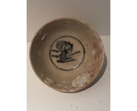 A C17th/C18th blue and white shipwrecked bowl, possibly SE Asian with indistinct central motif H 5cm D 11.5cm together with a