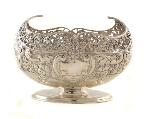 Victorian silver bon-bon dish with pierced and repousee scrolling decoration, on oval pedestal foot, height approx. 11.5cm, w