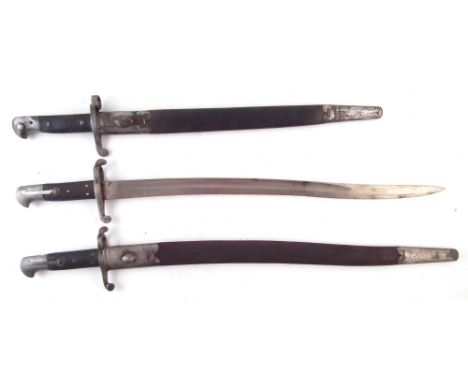 Three Victorian British bayonets, to include an 1887 Martini Henry bayonet and scabbard, stamped VR 3.93, a 1860 Martini Henr