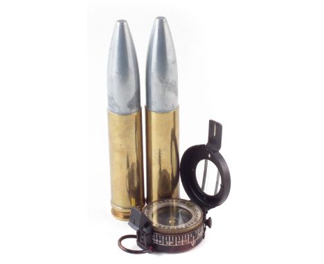 British WW2 MkIII compass by H.B.S Ltd dated 1944, also two inert Radway Green 30mm Aden Cannon rounds standing 19cm high.