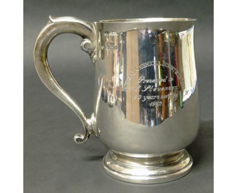 A silver mug with presentation inscription Condition reports are not available for our Interiors Sales.