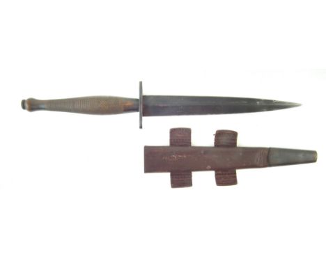 Fairbairn Sykes commando knife, second pattern, with leather scabbard, the guard stamped with broad arrow and inspectors stam