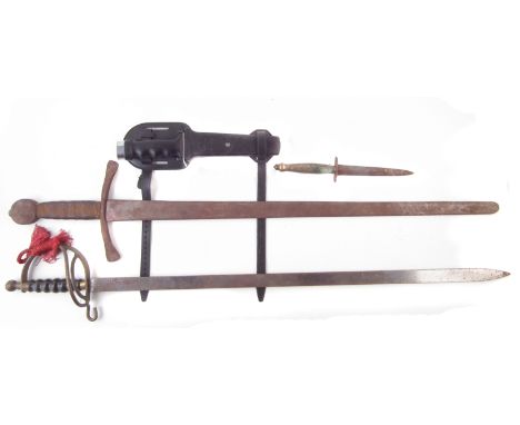 Italian diving knife by Cressi Sub, with scabbard, together with two reproduction swords and one other dagger, the largest me