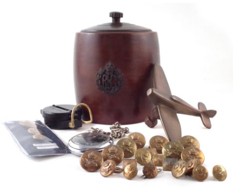RFC and RAF related items, to include a tobacco barrel, apprentice piece brass fighter model, group of King's Crown buttons, 