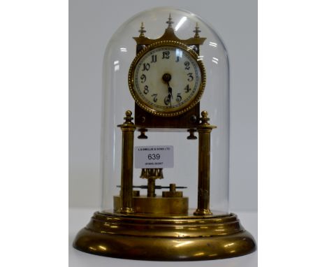 AN OLD BRASS MANTLE CLOCK WITH WHITE ENAMEL DIAL & GLASS DOME COVER     