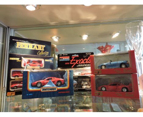 A 1990s boxed Maisto Ferrari Collection 5 piece die-cast model vehicle set, together with a boxed set of six 1:87 scale model