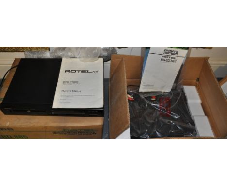 A Rotel amplifier, together with CD player and tape cassette deck (the former with manual tray operation only, the latter in 