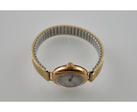 A 9ct gold vintage manual wind wristwatch, the Arabic dial with blued steel hands on bracelet strap with wire lugs