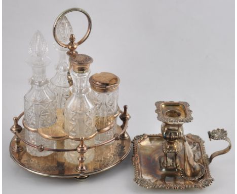 A Victorian style silver plated four bottle table creut together with a silver plated chamber stick