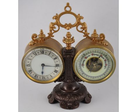 A Victorian brass drum cased 8 day clock and barometer with enamel dials on gilt bronzed stand, working condition, 24 x 21cm