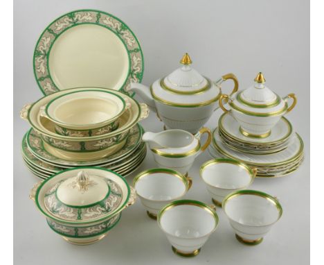 A Continental bone china tea service, the white ground decorated with green and gilt bands, comprising teapot, milk jug, suga