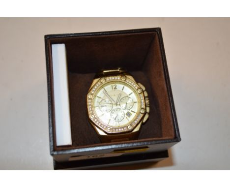 A Michael Kors gold plated wrist watch with booklet 