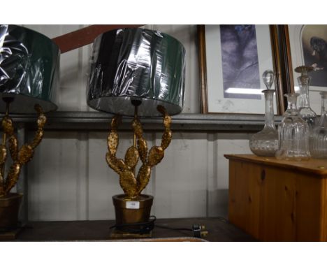 A novelty table lamp and shade in the form of a cactus 