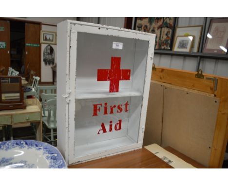 A metal and glass First Aid cabinet 