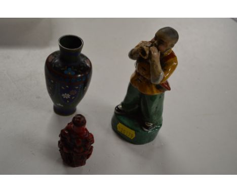 A Chinese red cinnabar style scent bottle together with a small cloisonne vase and a pottery figure 