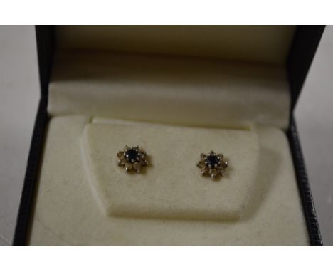 A pair of 9 carat gold diamond and sapphire earrings