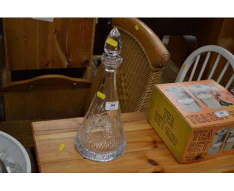 A glass decanter and stopper 