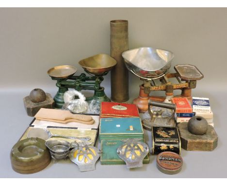 Two sets of scales with brass weights, two mounted small cannon balls, a brass Royal Marine naval artillery souvenir, shell c