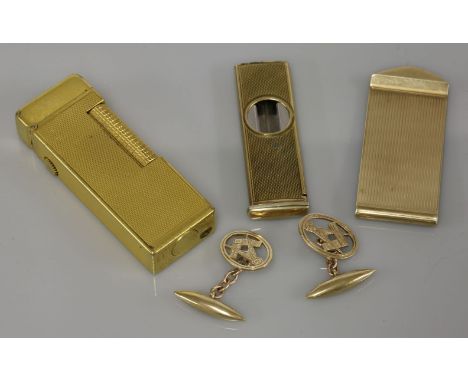 A 9ct gold money clip, a pair of 9ct gold Masonic cufflinks, a 9ct gold cigar cutter, and a gold plated Dunhill lighter, cuff