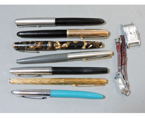 Six assorted fountain pens, including a Parker Duofold 14K pen nib example, and two watch heads including a 1930s silver plat