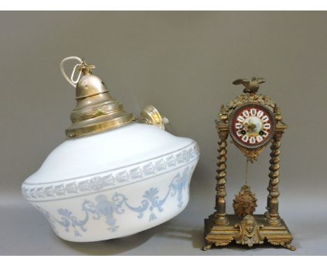 A Continental drum clock, with barley twist supports and painted porcelain dial, 38cm tall, and a hanging light fitting with 