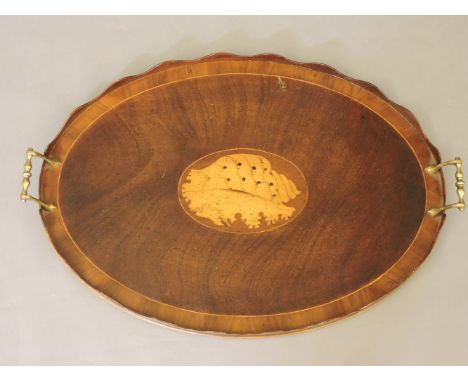 A Georgian style mahogany twin handled tray, inlaid with shell surround and gallery