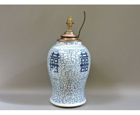 A Chinese blue and white vase, first half of 19th century, with trails of feathery scrolls enclosing double 'xi', four charac