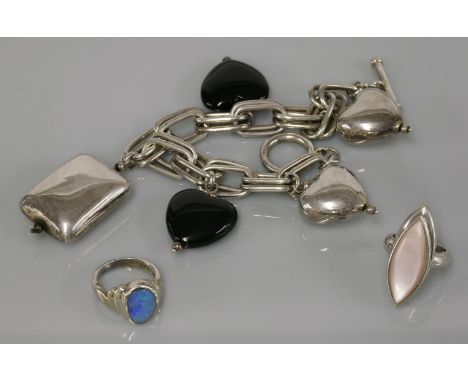 A silver two row fetter chain charm bracelet, stamped 925 with paste hearts and rectangular charms, a silver marquise shaped 