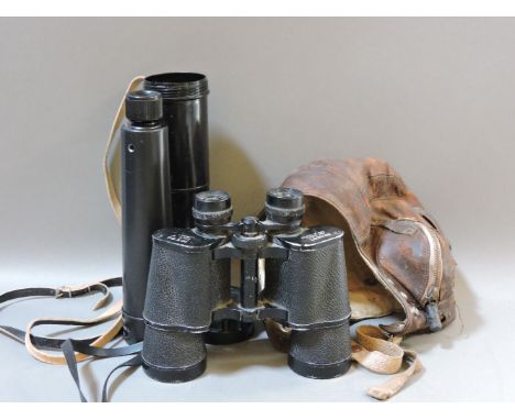 A World War II pilot's leather helmet, a Russian spotting scope, and a pair of Regent 10 x 50 binoculars, a folding machete a