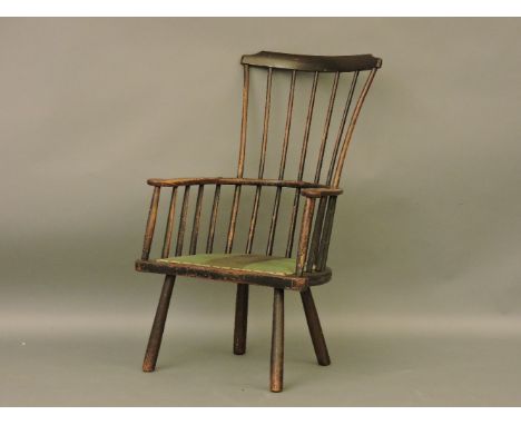 An 18th century comb back Windsor armchair