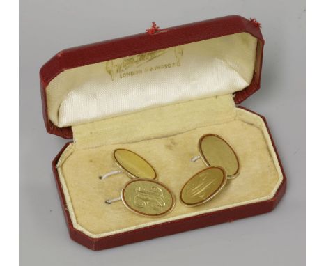 A pair of 18ct gold cufflinks, engraved with initials and inlaid with red enamel border