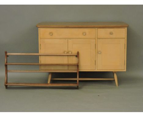 An Ercol sideboard, with two drawers, three cupboards, and a two tier plate rack