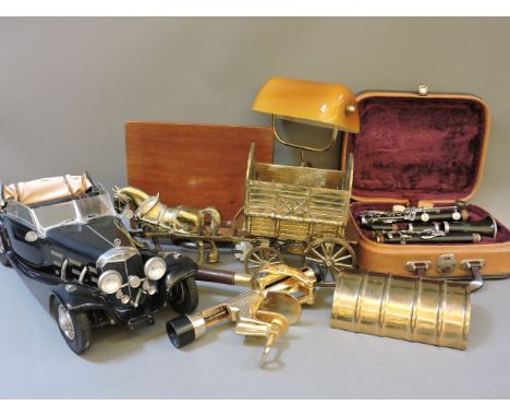 A cased Corton clarinet, a student's lamp, a reading stand, a bar corkscrew, a model case, and a horse and caravan