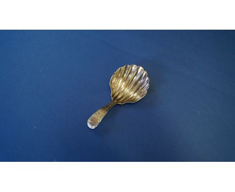 A George III silver tea caddy spoon, London 1794, having bright cut decoration and shell shaped bowl, 7.2cm. Condition Report