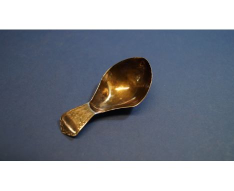 A silver caddy spoon, by Charles Hougham, London 1791, having bright cut decoration to handle, 7cm.