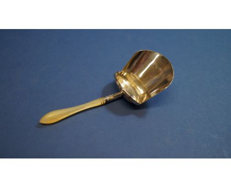 A George III silver caddy spoon, having mother of pearl handle, by Joseph Wilmore, Birmingham 1810, 9cm. Condition Report: Ve