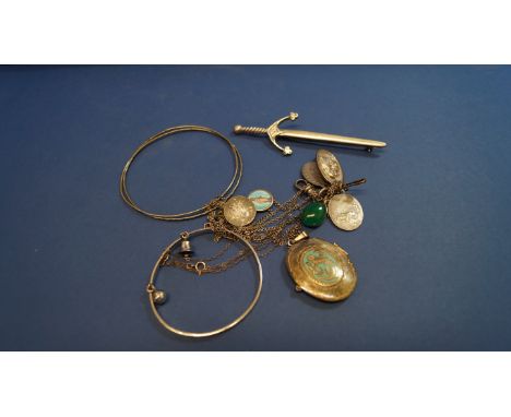 A 14k white gold bright cut bangle; together with a Scottish silver sword brooch; and a small quantity of other jewellery ite