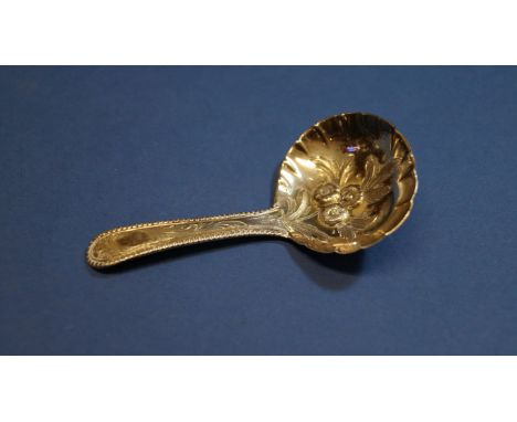 A George III silver tea caddy spoon, by Robert Rutland, London 1809, 8.8cm. Condition Report: good.  Marks clear. Later decor